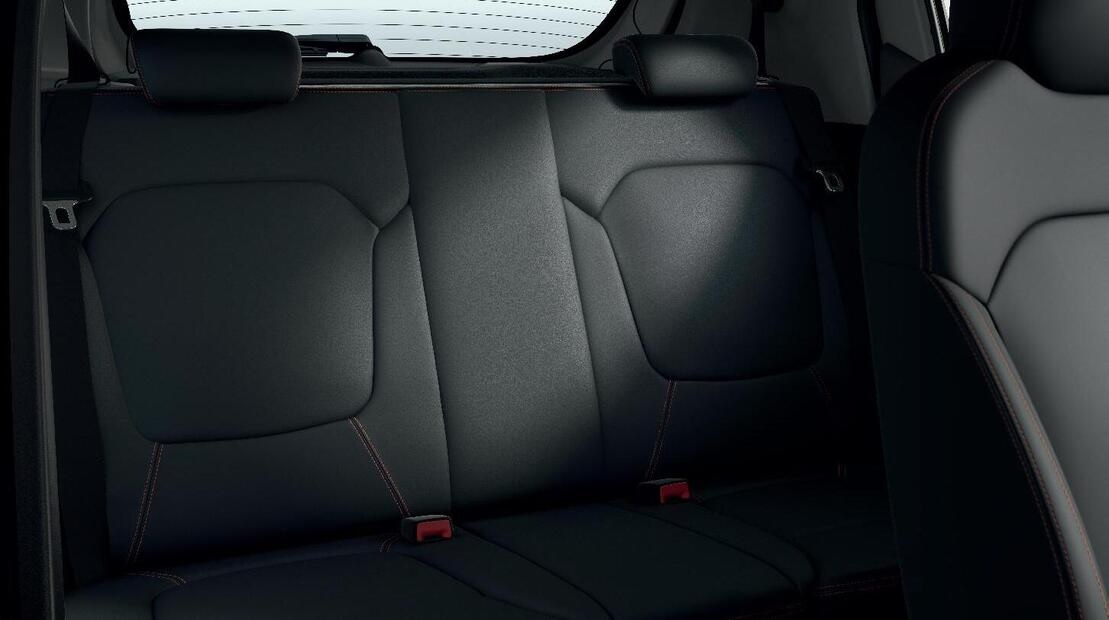 Textile upholstery in black with geometric patterns on the sides, orange stitiching and Stepway emblem